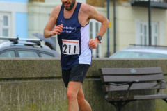 Mike Denson battles the weather